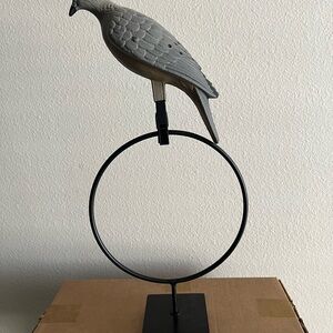 Elegant Gray Bird Sculpture on Black Stand